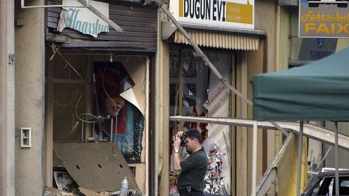 A June 9, 2004 photo of a bombed barber's shop in Cologne, Germany. 