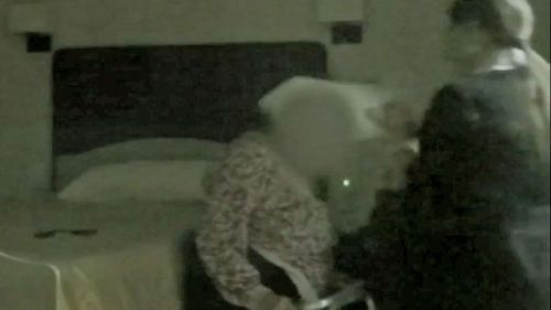 An aged care worker was caught on film ripping clothes off her 85-year-old patient, aggressively putting her night gown on, slapping the woman four times, threatening and hitting the woman in the side of her head with a bag of rubbish.
