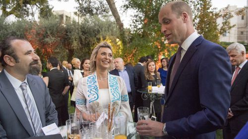 The Duke of Cambridge speaks to Alia Twal, the first woman pilot on Royal Jordanian Airways, as he attends the Queen's Birthday Party at UK Ambassador's residence in Amman, Jordan at the start of his Middle East tour,. Picture