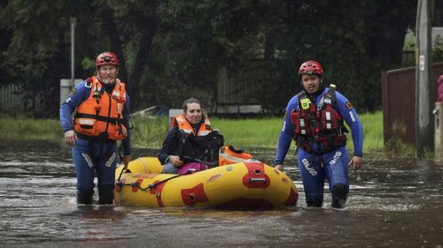 Simone Baluch is rescued, along with her dog and adopted litter of kittens, from a property on Davy Robinson Drive in Chipping Norton south west Sydney. 