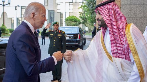 In this image released by the Saudi Royal Palace, Saudi Crown Prince Mohammed bin Salman, right, greets President Joe Biden with a fist bump after his arrival at Al-Salam palace in Jeddah, Saudi Arabia, Friday, July 15, 2022. (Bandar Aljaloud/Saudi Royal Palace via AP)