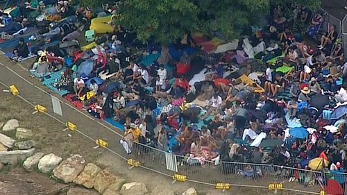 Revellers have been lining up since yesterday to ensure they secure a prime spot. (9NEWS)