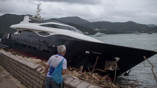 This yacht was washed up on a sea wall in Hong Kong.