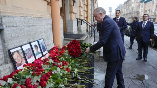 St. Petersburg Governor Alexander Beglov lays a bunch of flowers at the Consulate of Azerbaijan in the memory of victims of the Azerbaijan Airlines' Embraer 190 that crashed near the Kazakhstan's airport of Aktau.