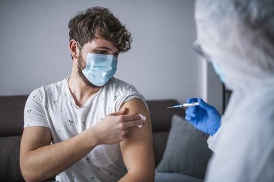 Man getting vaccinated. Vaccine. Needle