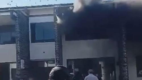 Detainees have jumped from a two-storey building by kicking open glass windows and landing on a mattress after a fire broke out at an immigration detention centre in Sydney's west.