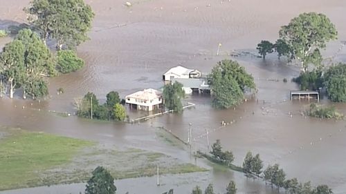 Floodwaters inundate buildings. (9NEWS)