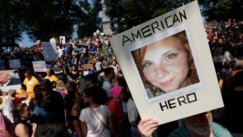 Counter-protesters paid tribute to Heather Heyer, the woman killed at the Virginia rally. (AP)