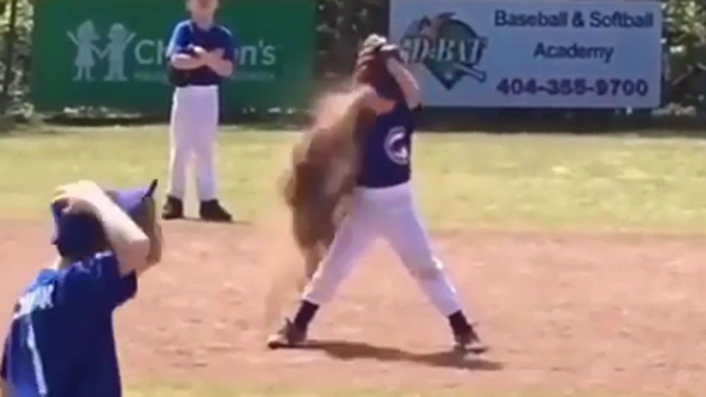 Bored baseball kid dumps dirt on his head 