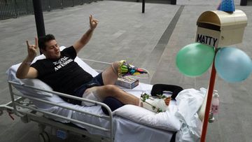 Mathew McHugh jokes around in his hospital bed after the accident. (Supplied)
