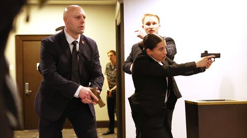 Secret service agents respond during the White House Correspondents' Dinner.