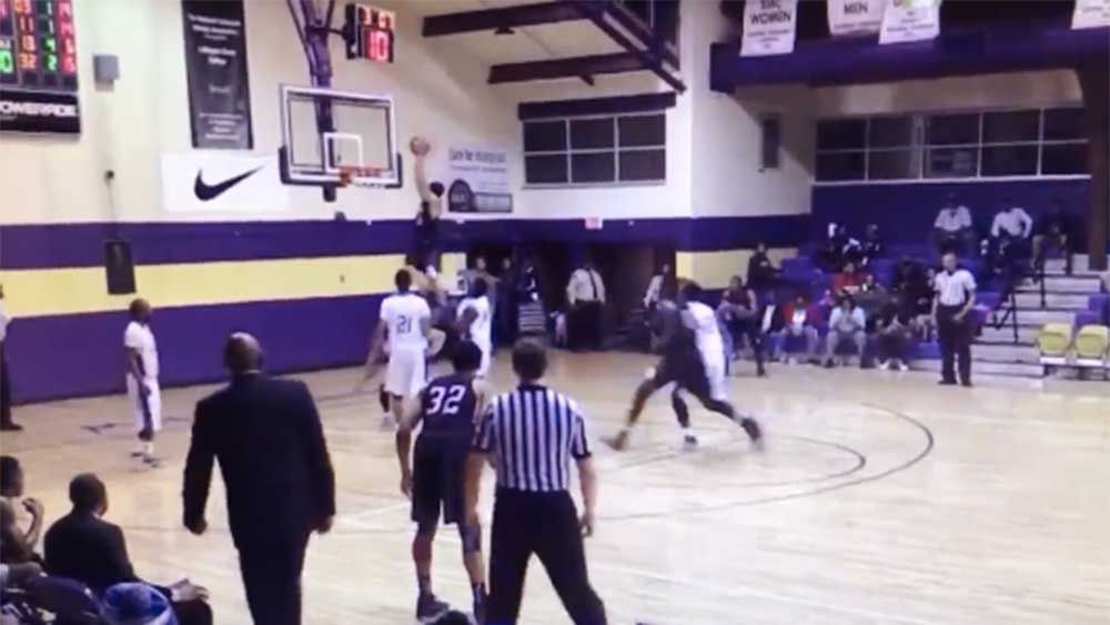 Basketball player launches off rival for brutal dunk 