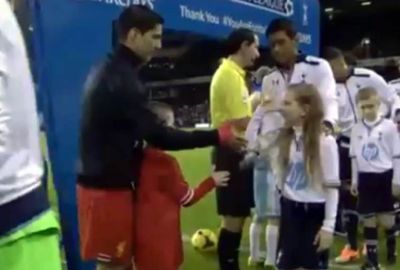 <b>A mascot has provided the only bright moment for Tottenham in their loss to Liverpool by snubbing Reds captain Luis Suarez in the pre-match handshakes. </b><br/><br/>The young girl chose to wiggle her fingers with her thumb on her nose instead of shaking hands with the Uruguayan master. <br/><br/>Suarez and Spurs rival Paulinho were all smiles as they watched the girl pull off the joke. <br/><br/>The handshake was full of irony given Suarez's snub of Manchester United's Patrice Evra after his ban for racist abuse last year. <br/><br/>Click through to watch the funny moment. <br/>