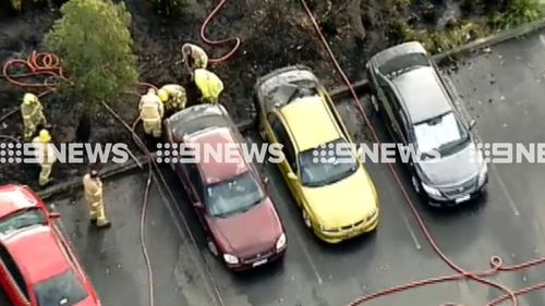 Fire fighters remain at the scene. (9NEWS)