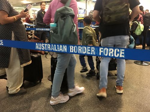 Brisbane - Dec 02 2022:Passengers walking through Australian border force lines.