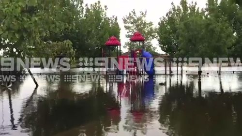 Local playgrouns have been left partly flooded near residential houses. (9NEWS)