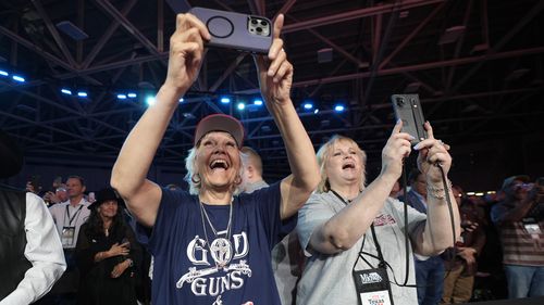 Supporters cheer for former President Donald Trump before he speaks at the National Rifle Association Convention, Saturday, May 18, 2024, in Dallas. (AP Photo/LM Otero)