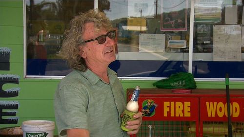 Petrol station owner Mick Prio stayed behind to protect the station against spot fires. (9NEWS)