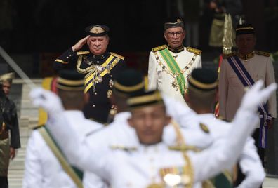 Sultan Ibrahim Sultan Iskandar, left, salutes the guard of honor besides Malaysia's Prime Minister Anwar Ibrahim at National Palace in Kuala Lumpur, Malaysia Wednesday, Jan. 31, 2024.  