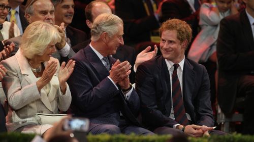 Prince Charles with his son Prince Harry at the opening ceremony of the Invictus Games in 2014. (AAP)