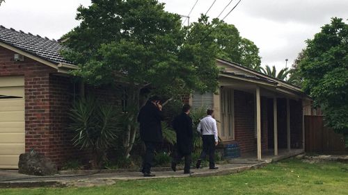 Detectives arriving at the home following the shooting. (AAP)