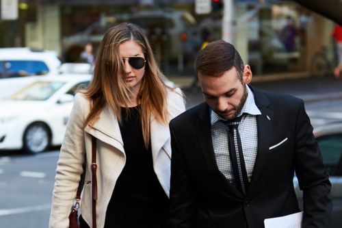 Eagle was flanked by her legal tea as she entered court. Picture: AAP