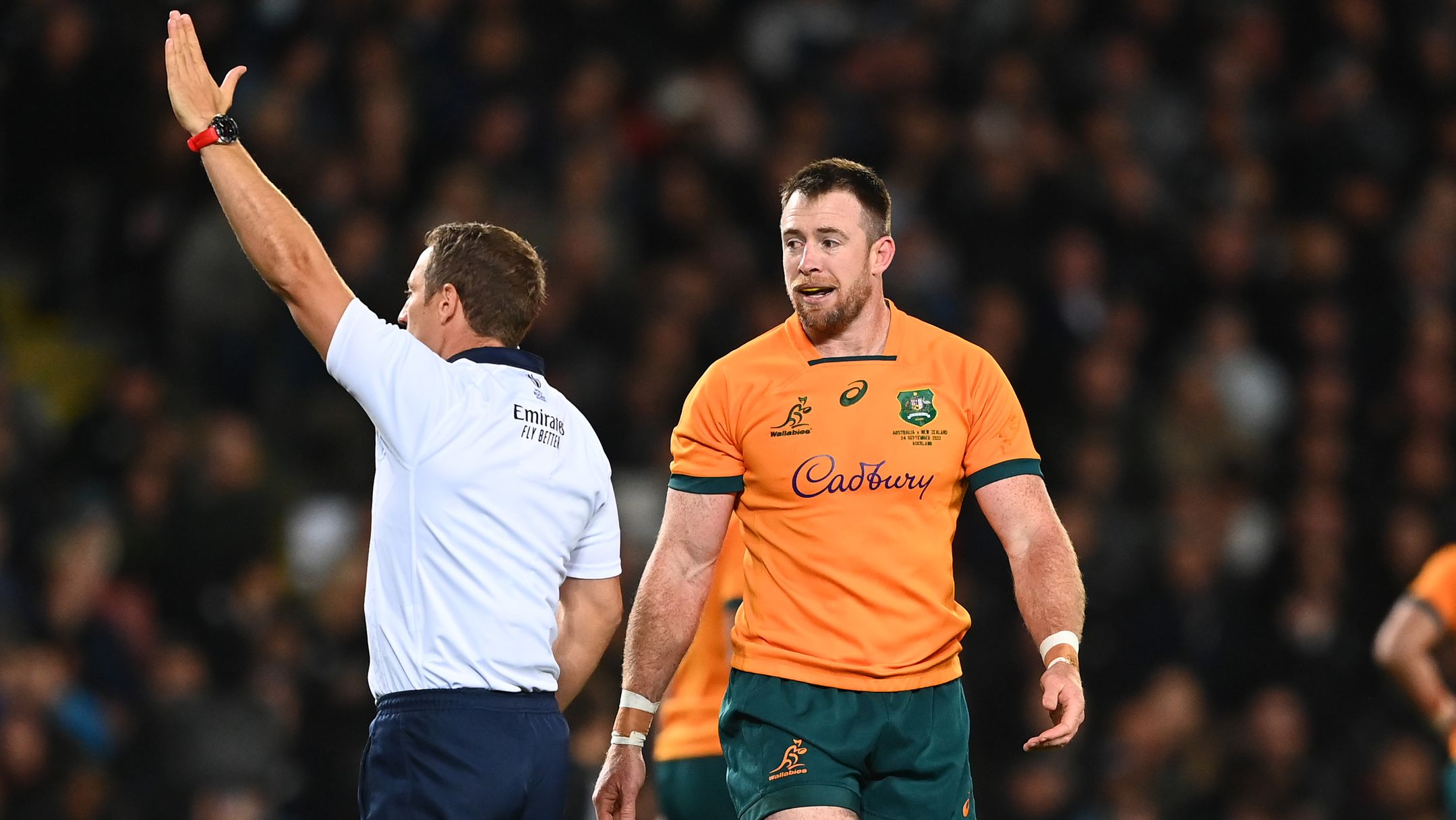 Jed Holloway of the Wallabies receives a yellow card from referee Andrew Brace.