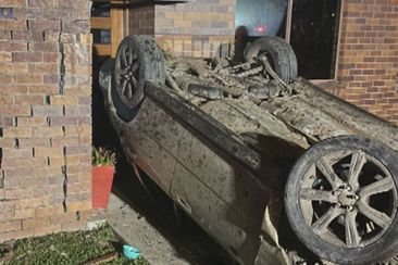 A Queensland driver has left a trail of destruction after a Subaru smashed through fences and crashed into a home south of Brisbane. Loganholme