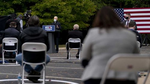 Joe Biden speaks at a socially distanced campaign event in Grand Rapids, Michigan.