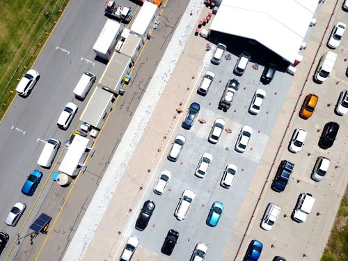 Cars queue for the COVID-19 testing facility at Victoria Park, just outside the Adelaide CBD