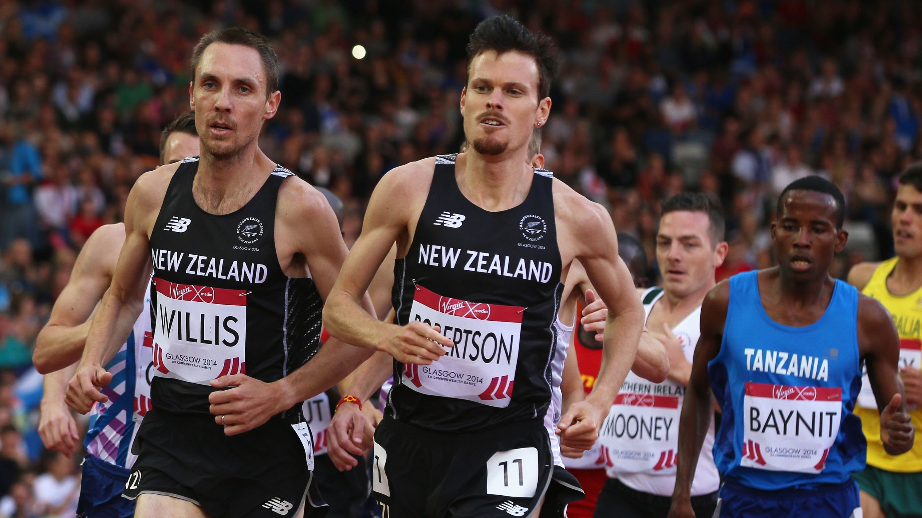 Zane Robertson (middle) runs with Nick Willis during the 2014 Commonwealth Games.