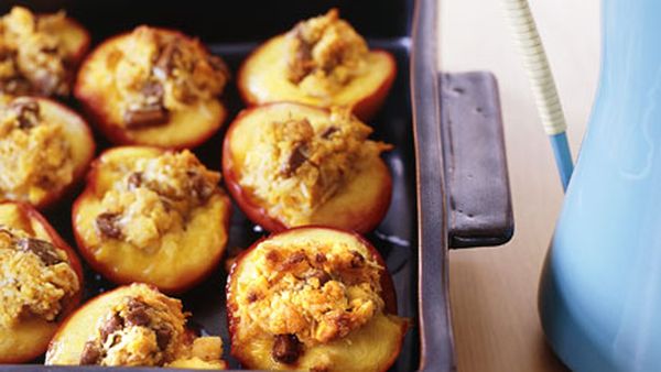 Baked nectarines stuffed with coconut and milk chocolate