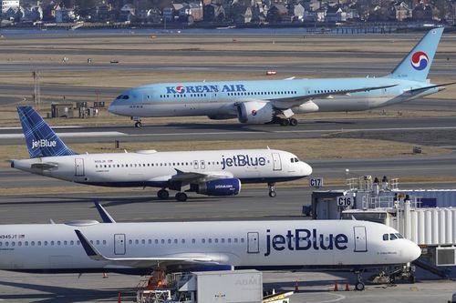 Passenger jets on the tarmac at Logan International Airport, Jan. 11, 2023, in Boston.  