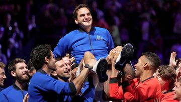 Team Europe&#x27;s Roger Federer is lifted by fellow players after playing with Rafael Nadal in a Laver Cup doubles match.