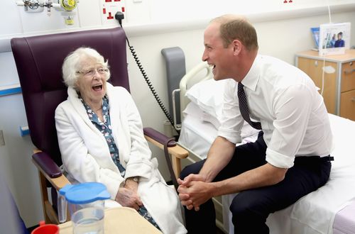 The Duke of Cambridge shares a joke with patient Theresa Jones in the frailty unit during his visit to Aintree University Hospital. (AAP)