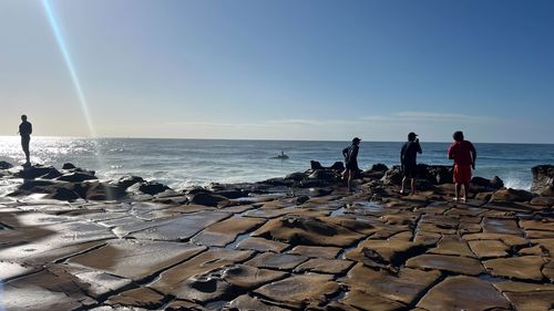 A search for a missing 15-year-old resumes at North Avoca Beach on the NSW Central coast.