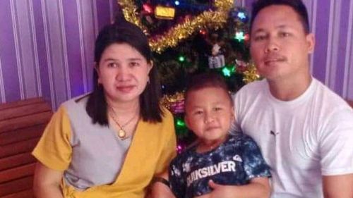 Yohanes Suherdi, 30, poses with his wife Susilawati Bungahilaria and their 5-year-old son, Rian Gusti Rafael, in this Christmas portrait.