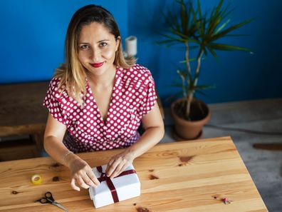 Woman wrapping Christmas presents