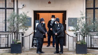 Police officers are seen outside the King Edward VII hospital where Prince Philip, Duke of Edinburgh is currently receiving treatment on February 18, 2021 in London, England