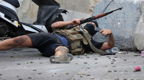 A man reloads during the clashes in Beirut. 