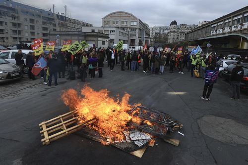 Railway workers gather in protests at the Gare de Lyon train station, Thursday, April 6, 2023 in Paris. 