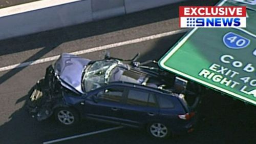 The aftermath of the four-tonne sign calling on the Hyundai SUV.