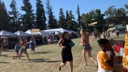 Scenes purportedly showing people fleeing a shooter at California's Gilroy Garlic Festival. Image courtesy: Twitter wavyia