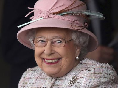 Britain's Queen Elizabeth II smiles as she attends an event at Newbury Racecourse in Newbury England, Friday April 21, 2017.