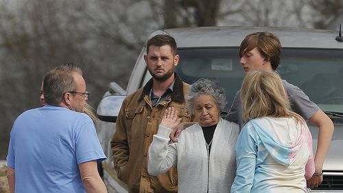 Rebecca Payne (center) is consoled by family members after former Lonoke County sheriff's deputy Michael Davis was convicted of negligent homicide on Friday, March 18, 2022, in Cabot. Davis shot Hunter Brittain, Payne's grandson, during a traffic stop last year.  More photos at www.arkansasonline.com/319trial/ (Arkansas Democrat-Gazette/Thomas Metthe)