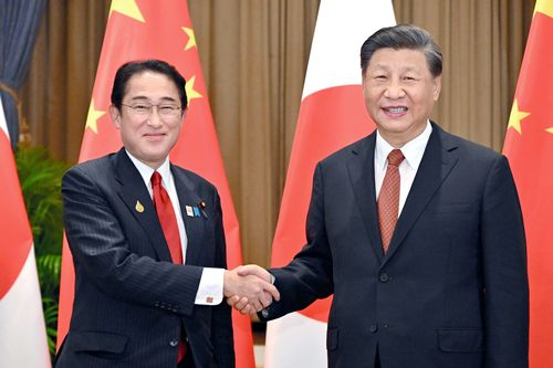 Japanese Prime Minister Fumio Kishida, left, and Chinese President Xi Jinping shake hands at the start of their meeting, on the sidelines for the Asia-Pacific Economic Cooperation, APEC, forum, Thursday, Nov. 17, 2022, in Bangkok, Thailand. 