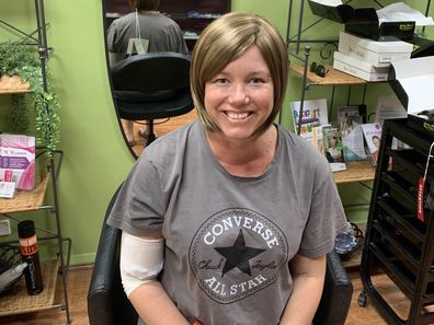 Fiona May in a wig after losing her hair during cancer treatment.