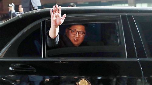File photo, North Korean leader Kim Jong Un waves from a car as he returns to North Korea after the April meeting with South Korean President Moon Jae-in. (AP)