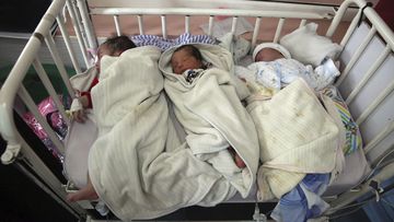 Newborn babies were rushed by police, soldiers and hospital staff to another hospital in Kabul.