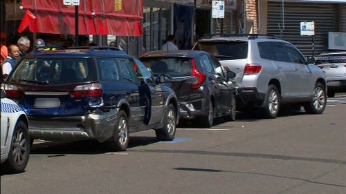 The woman's Subaru also allegedly struck parked cars. (9NEWS)